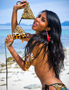 Beautiful raven-haired slender ladyboy takes off her sexy bikini in the sea