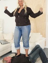 Fat blonde touches guy's face with her shoes when trampling him on the floor at