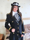 British police girl in uniform poses and strips showing her long legs in black p
