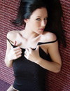 Adorable brunette with perfectly shaped body sexily rubs smooth skin and flashes