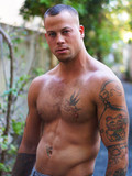 Two perfectly sculptured gay guys pose naked and please each other with their ha