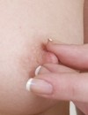Teen girl in black teddy and stiletto heeled boots fingers her pussy and pinches