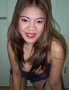 Cuddly Filipina bimbo gets rid of her shiny outfit and poses in a blue thong wit