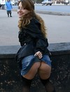Playful Russian chick in jean mini skirt flashes her shaved snatch in public