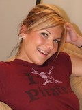 Smiling amateur girl Kayla poses in blue panties and flashes her cute pussy