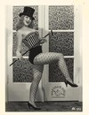 Retro style babe in fishnets goes topless to show her cute vintage boobs