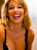 Bewitching Sofia Rain in black corset and fishnet stockings dirtily strokes her