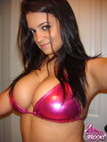Magnificent big boobed brunette in pink bikini gives sexy cleavage at home