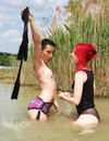 Wet clothed women reveal their assets in the open air and bare their nice asses