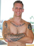 Handsome military guy with many tattoos gets naked and shows his nice cock