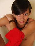 Cute dark haired gay boy makes his eyes on you when stripping nude to show his s