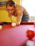 These topless handsome men love to kill time playing pool and posing together