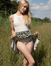 Pale blonde teen Kateryna gets nude in the field and shows her snatch in the sun