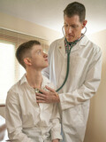 Short twink Jonathan gets his tiny asshole examined by a tricky gay doctor