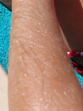The babe was sleeping on the beach and didn??t notice her hairy arms had been recorded