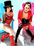Two dark haired porn divas dressed in red and black play with their sexy asses