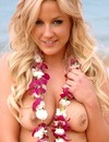 Luscious blonde teen Lia plays at the coast trying to hide her tits behind the flower leis