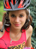 Barely legal pigtailed bicyclist takes off her clothes and shows her petite teen body outdoors