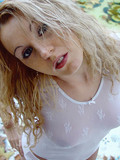 Cute faced amateur blonde girl Silvia poses in white see through tee shirt