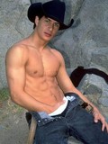 Strong guy in cowboy hat strips showing his perfect body and rock hard dick