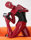Playful Taisija toys her tiny pussy with her skin tight latex costume on